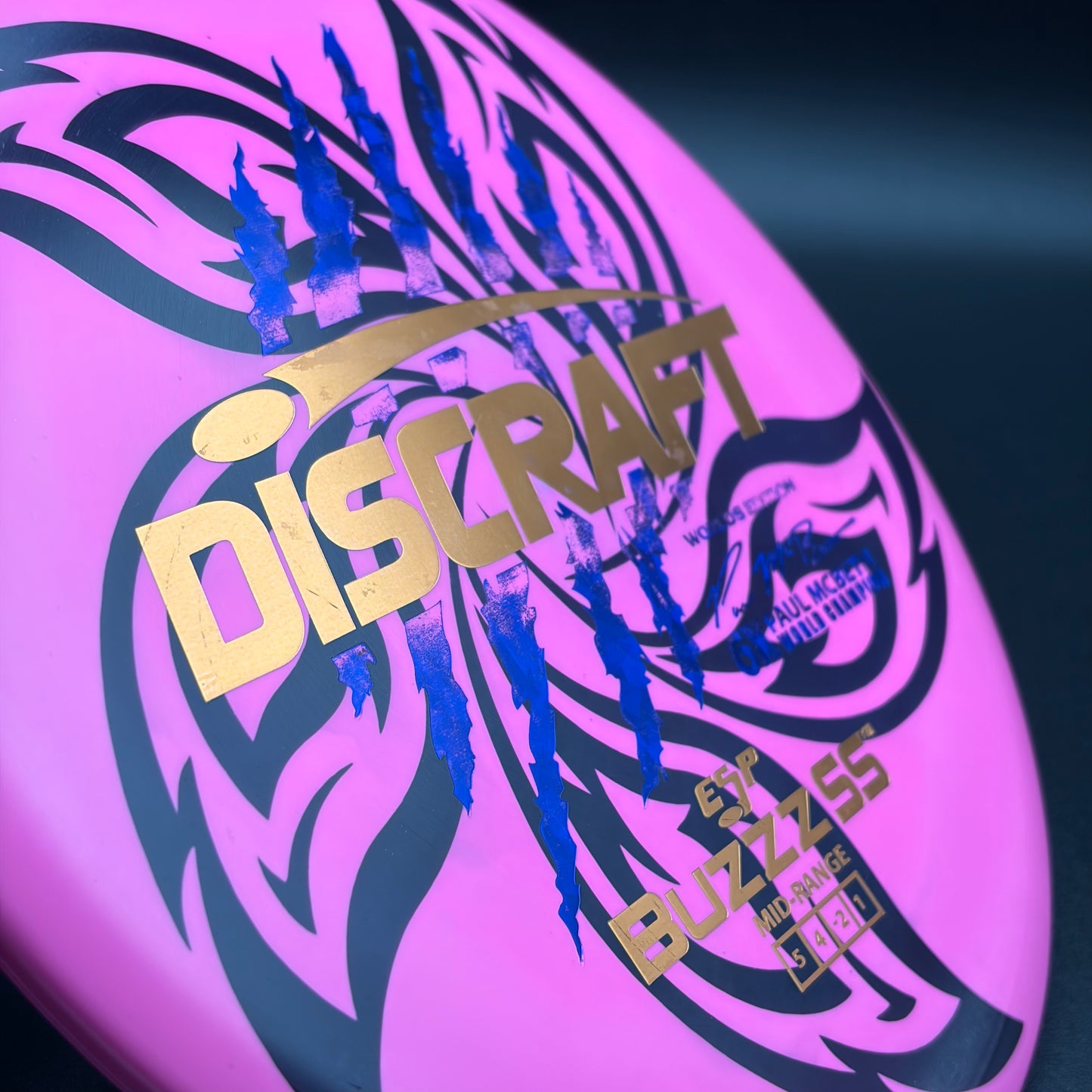 Lore | Discraft Paul McBeth 6x Claw Worlds Edition ESP Buzzz SS | Dark Blue Shatter/Metallic Copper/Metallic Gold | 170g